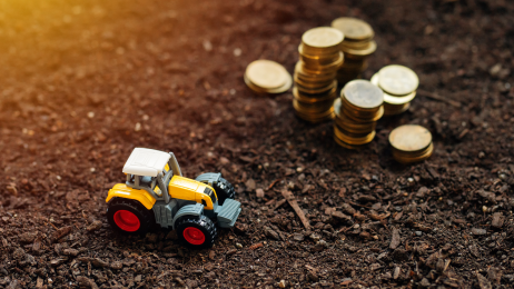 truck and coins within soil